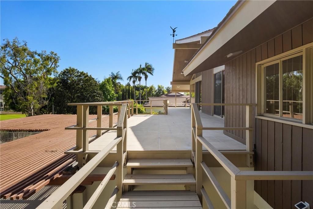 8780 Hillcrest Road Buena Park, CA 90621 - Photo 16 of 62 a view of balcony with wooden floor and seating space