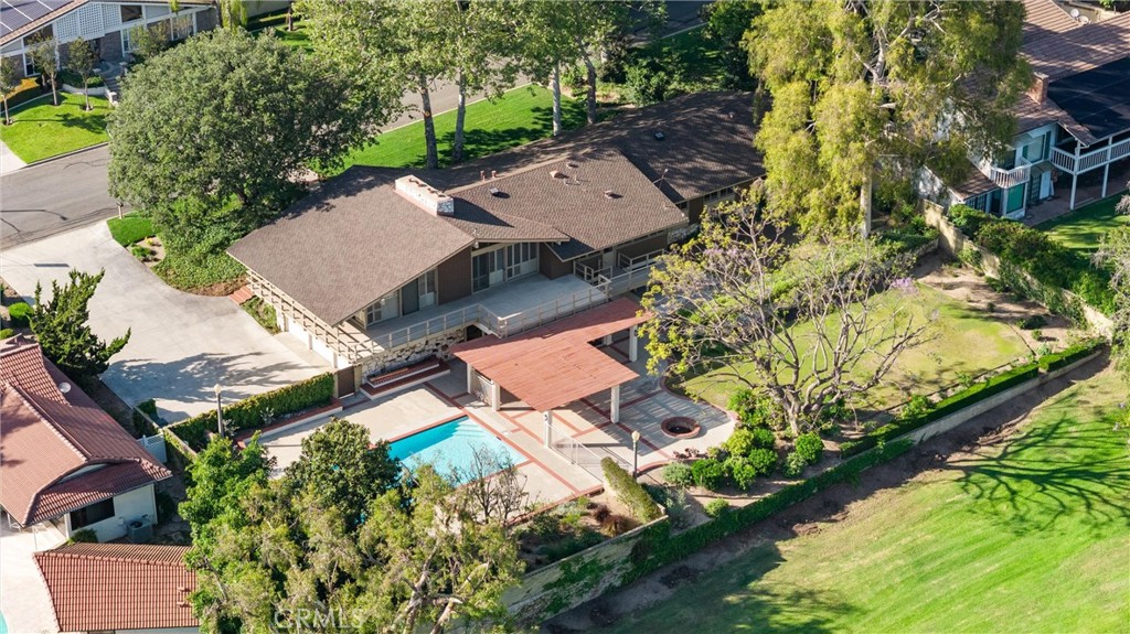 8780 Hillcrest Road Buena Park, CA 90621 - Photo 2 of 62 an aerial view of a house with a garden and lake view