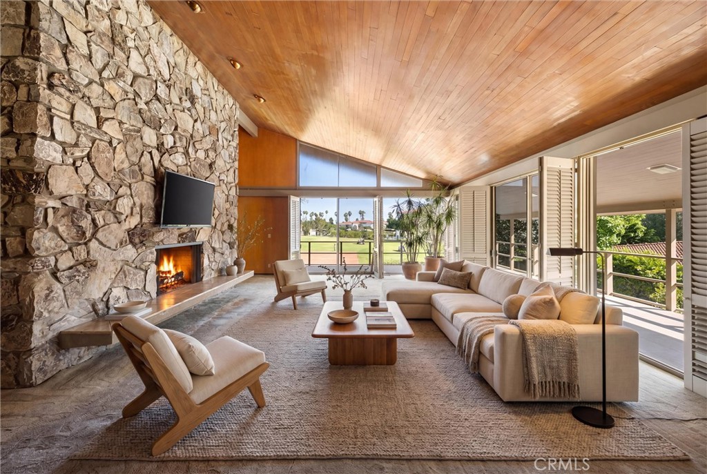 8780 Hillcrest Road Buena Park, CA 90621 - Photo 24 of 62 a living room with fireplace furniture and a large window