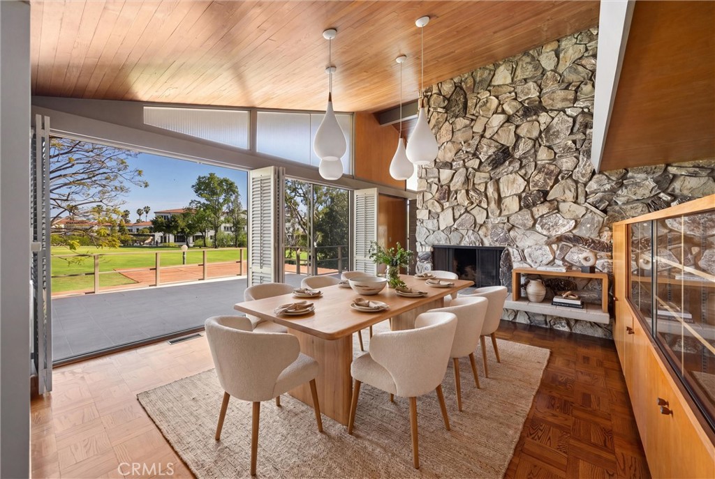 8780 Hillcrest Road Buena Park, CA 90621 - Photo 28 of 62 a dining room with fireplace furniture and a floor to ceiling window