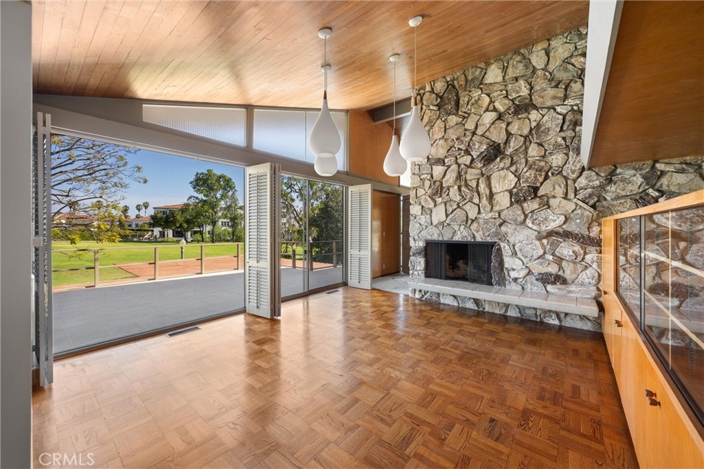 8780 Hillcrest Road Buena Park, CA 90621 - Photo 29 of 62 a view of an empty room with a fireplace and a window
