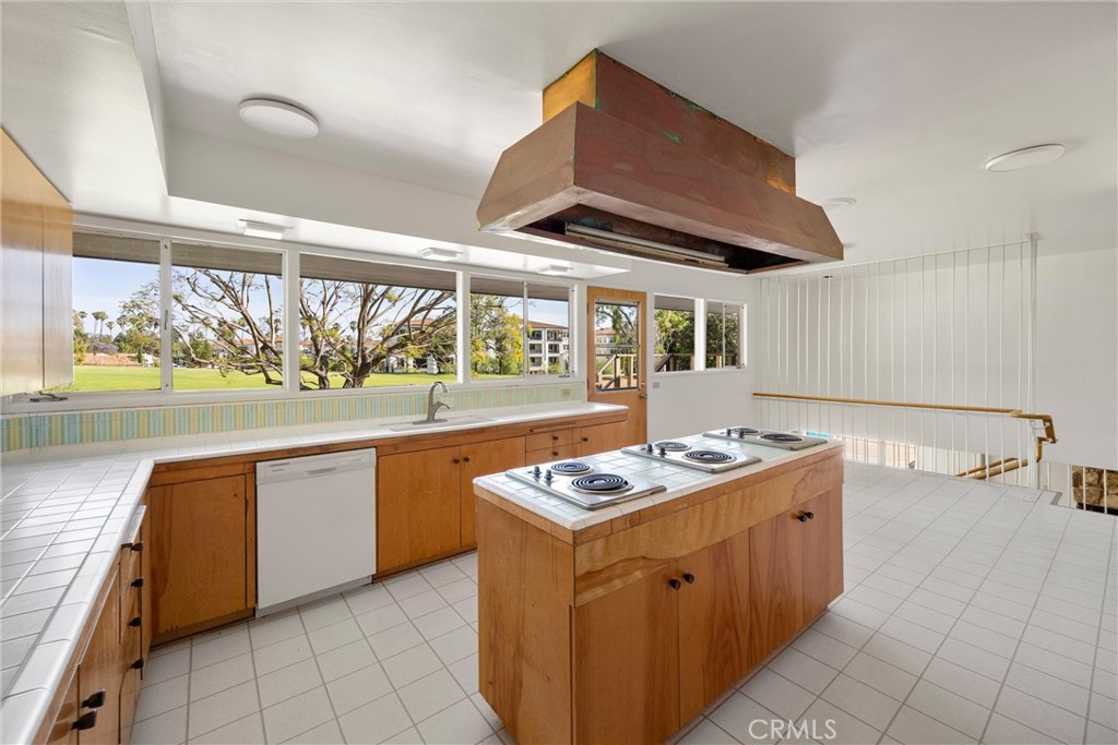 8780 Hillcrest Road Buena Park, CA 90621 - Photo 39 of 62 a kitchen with stainless steel appliances granite countertop a stove and a sink