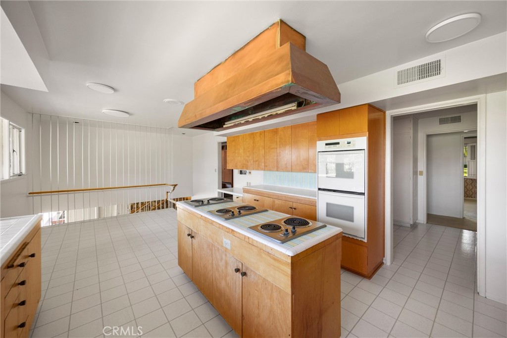 8780 Hillcrest Road Buena Park, CA 90621 - Photo 40 of 62 a kitchen with a stove and a sink