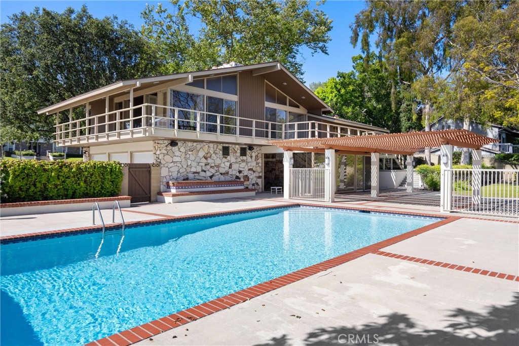 8780 Hillcrest Road Buena Park, CA 90621 - Photo 4 of 62 a front view of a house with swimming pool