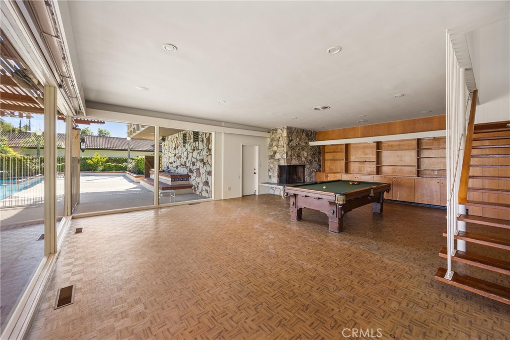 8780 Hillcrest Road Buena Park, CA 90621 - Photo 48 of 62 a living room with furniture and a floor to ceiling window