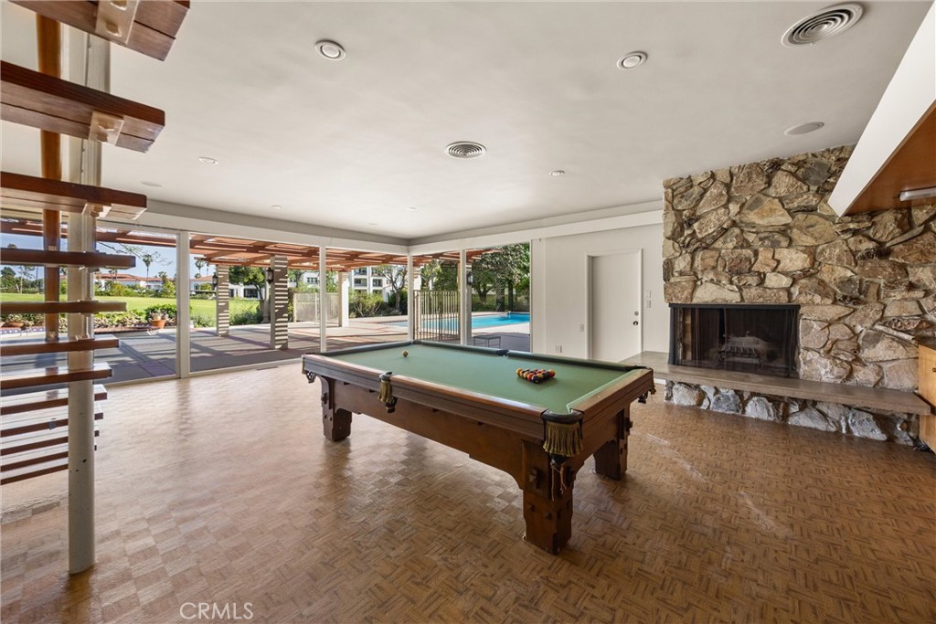 8780 Hillcrest Road Buena Park, CA 90621 - Photo 50 of 62 a living room with furniture a pool table and a fireplace