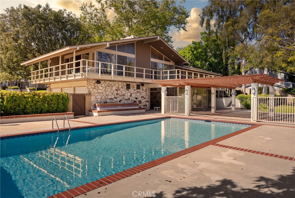 8780 Hillcrest Road Buena Park, CA 90621 - Photo 5 of 62 a view of a house with swimming pool and sitting area