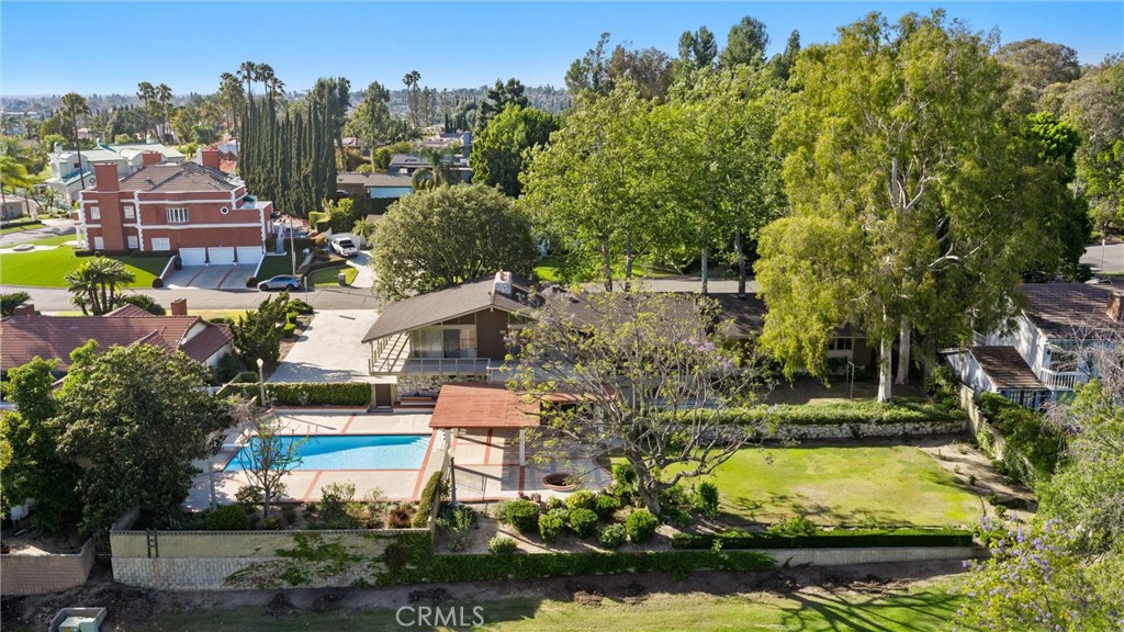 8780 Hillcrest Road Buena Park, CA 90621 - Photo 54 of 62 an aerial view of a house with swimming pool and a yard