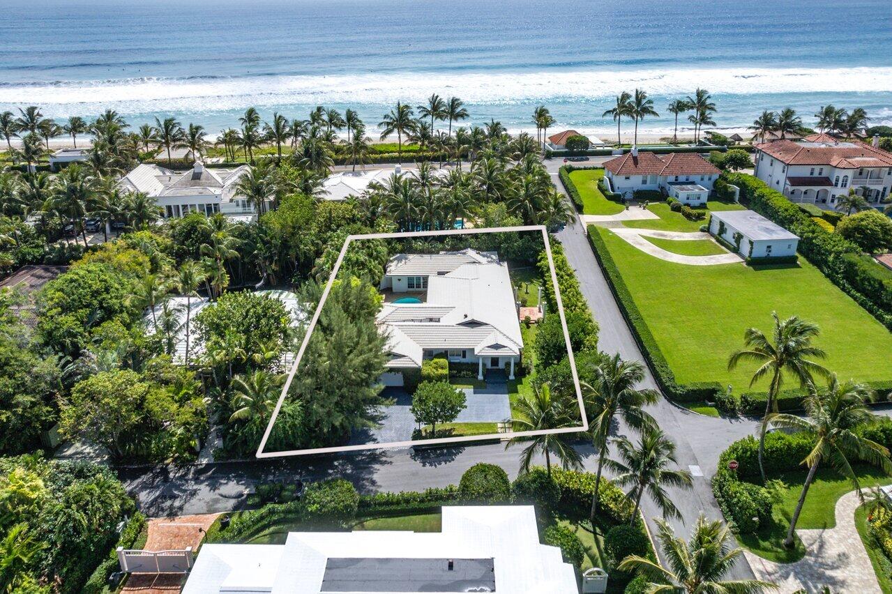 1287 North Ocean Way Palm Beach, FL 33480 - Photo 1 of 28 a view of a swimming pool with a garden