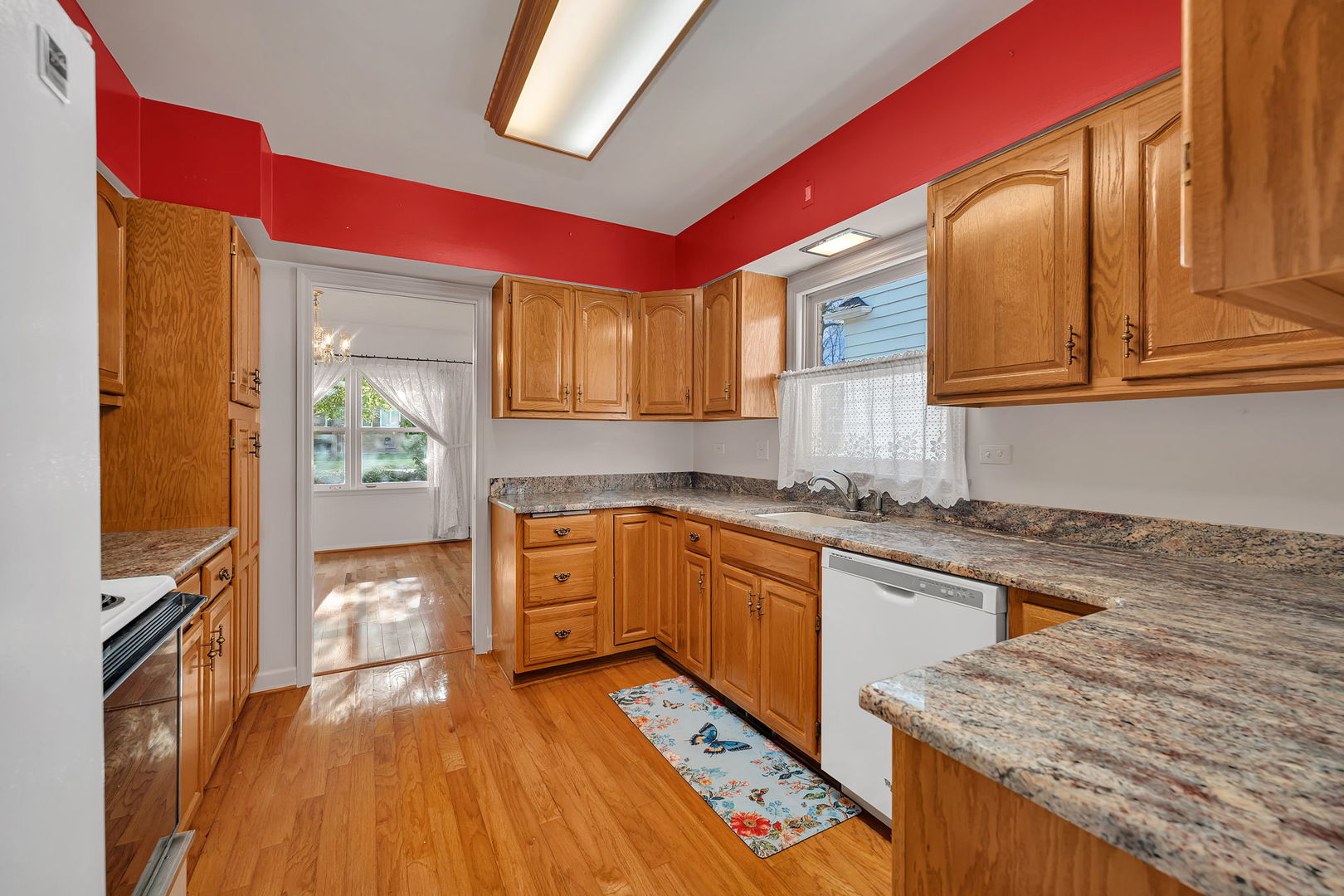 409 West Jefferson Street Morris, IL 60450 - Photo 3 of 44 a kitchen with stainless steel appliances granite countertop a stove a sink and a microwave