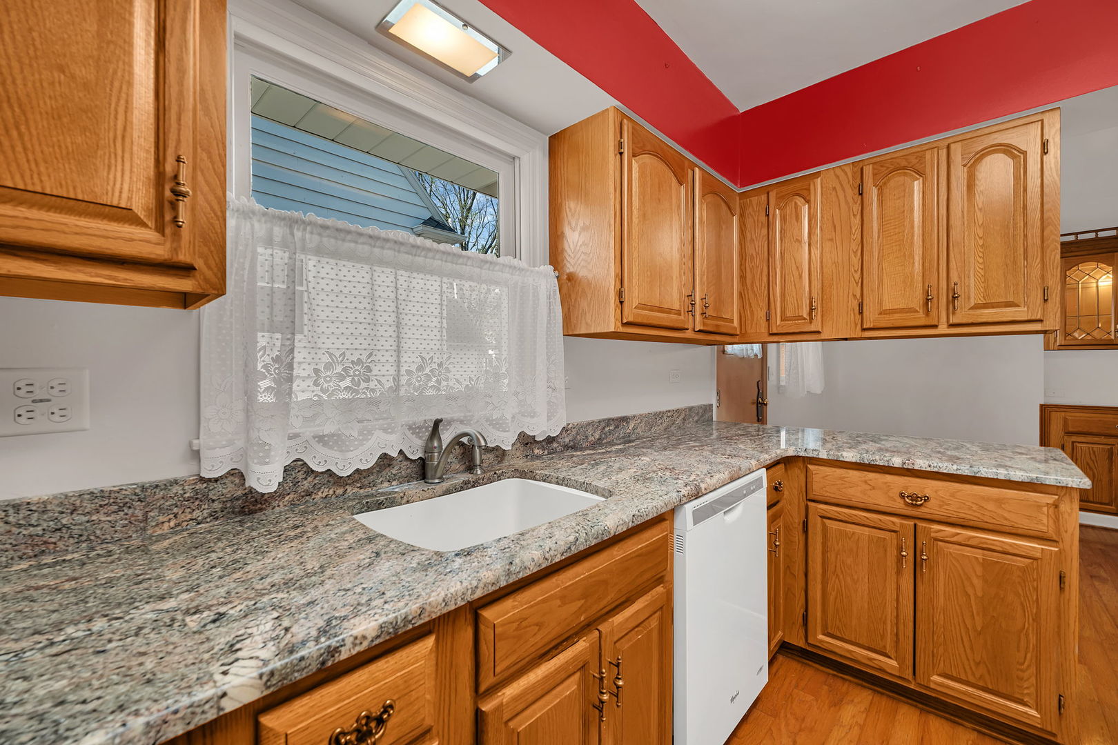 409 West Jefferson Street Morris, IL 60450 - Photo 5 of 44 a kitchen with sink cabinets and a window
