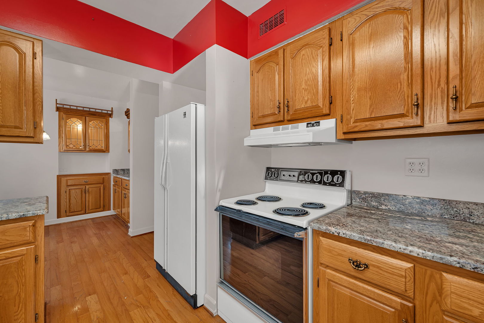 409 West Jefferson Street Morris, IL 60450 - Photo 6 of 44 a kitchen with granite countertop stainless steel appliances a stove refrigerator and cabinets