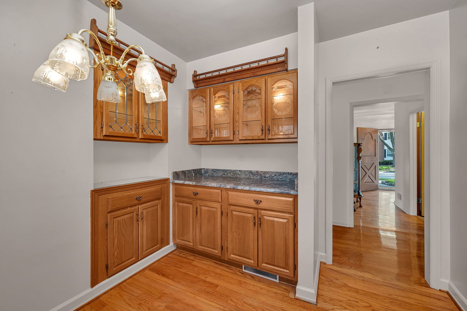 409 West Jefferson Street Morris, IL 60450 - Photo 7 of 44 a kitchen with stainless steel appliances granite countertop a stove and a wooden floors