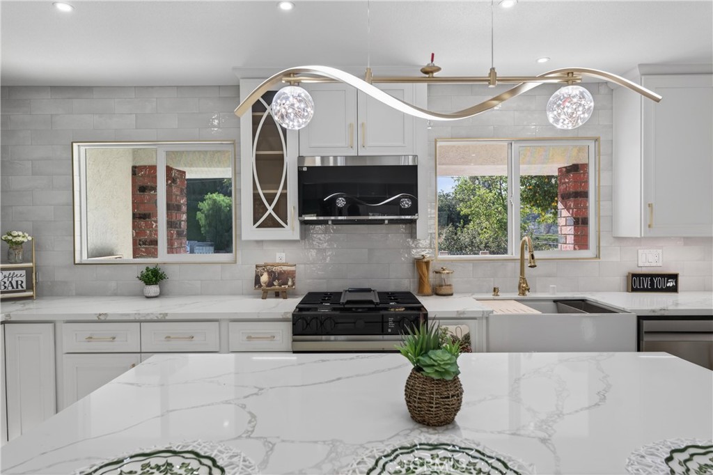 11891 San Timoteo Canyon Road Redlands, CA 92373 - Photo 21 of 68 a kitchen with a refrigerator a sink a stove and a window