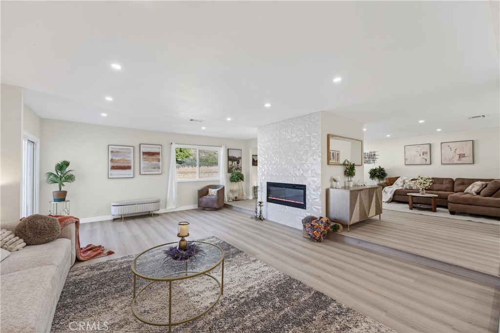 11891 San Timoteo Canyon Road Redlands, CA 92373 - Photo 24 of 68 a living room with furniture a window and kitchen view