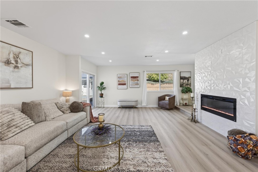 11891 San Timoteo Canyon Road Redlands, CA 92373 - Photo 25 of 68 a living room with furniture and a fireplace