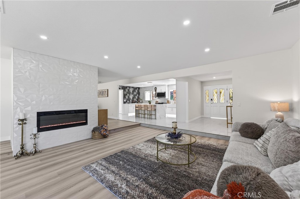 11891 San Timoteo Canyon Road Redlands, CA 92373 - Photo 26 of 68 a living room with furniture a rug and a fireplace