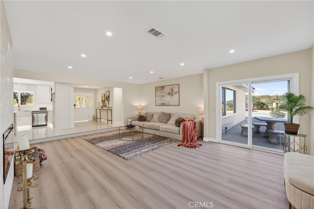 11891 San Timoteo Canyon Road Redlands, CA 92373 - Photo 28 of 68 a living room with furniture and a table