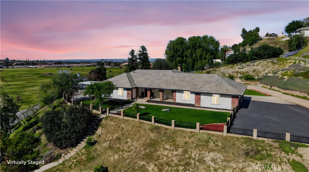11891 San Timoteo Canyon Road Redlands, CA 92373 - Photo 3 of 68 a view of a house with a yard and potted plants