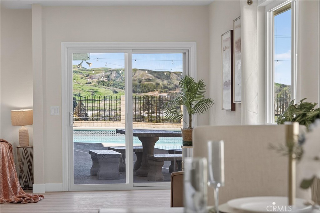 11891 San Timoteo Canyon Road Redlands, CA 92373 - Photo 34 of 68 a view of a living room with a floor to ceiling window and a potted plant