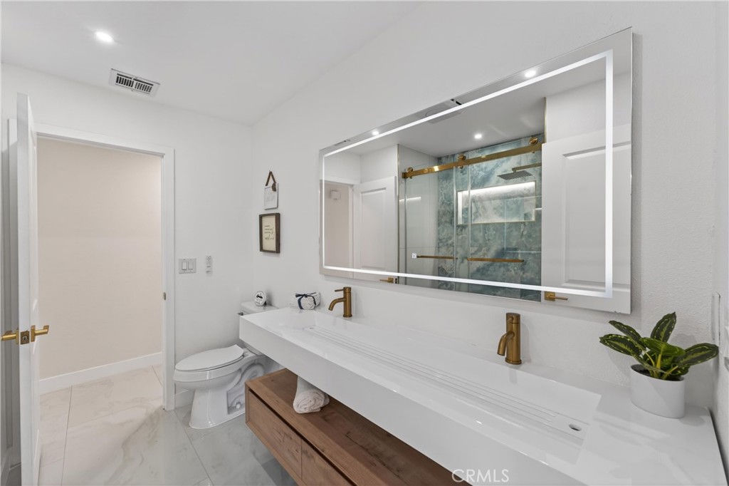 11891 San Timoteo Canyon Road Redlands, CA 92373 - Photo 38 of 68 a bathroom with a sink and a mirror