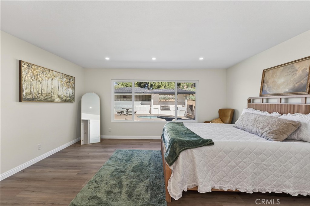 11891 San Timoteo Canyon Road Redlands, CA 92373 - Photo 40 of 68 a spacious bedroom with a large bed and a window