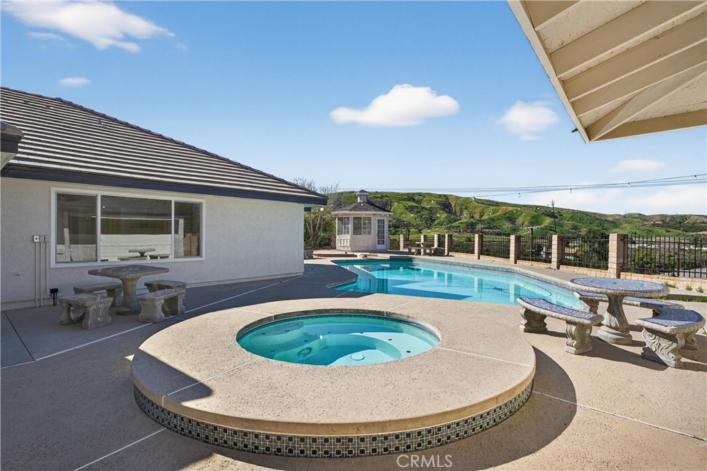 11891 San Timoteo Canyon Road Redlands, CA 92373 - Photo 49 of 68 a view of a swimming pool with a patio