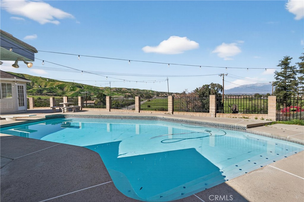 11891 San Timoteo Canyon Road Redlands, CA 92373 - Photo 50 of 68 a view of a kitchen with a sink and dishwasher a stove top oven with wooden floor