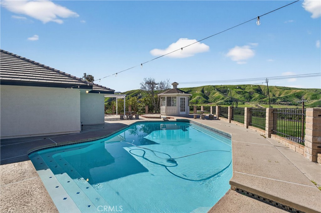 11891 San Timoteo Canyon Road Redlands, CA 92373 - Photo 54 of 68 a view of a swimming pool with a patio