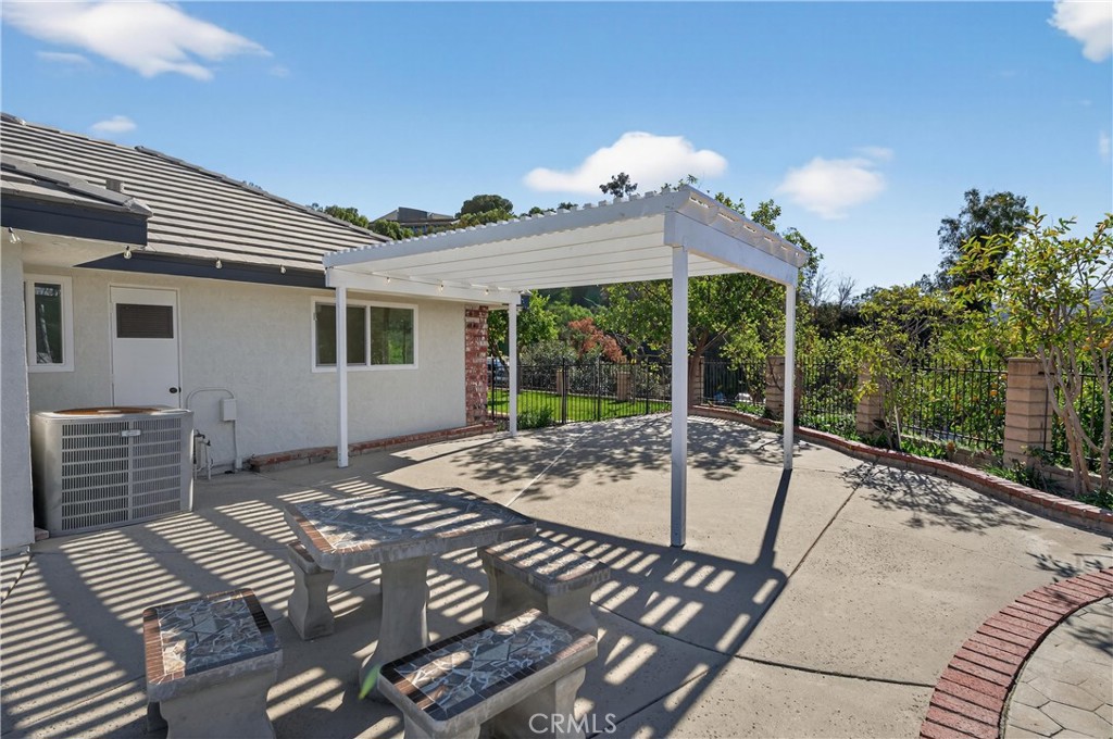 11891 San Timoteo Canyon Road Redlands, CA 92373 - Photo 55 of 68 a view of a patio with a table and chairs