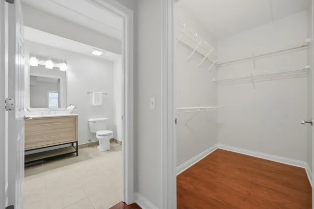 a bathroom with a sink and a view of bathroom