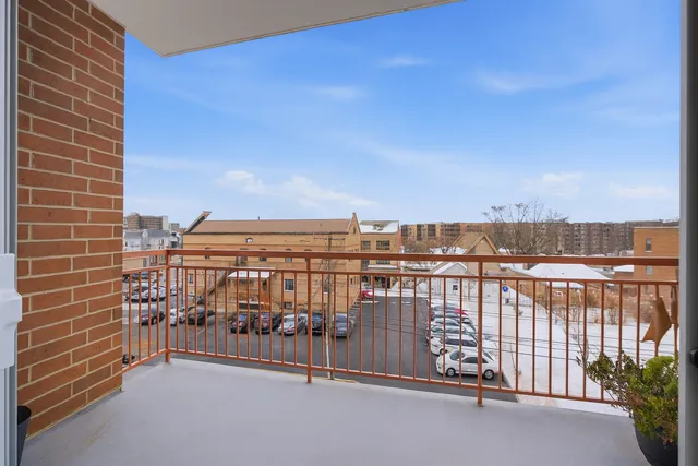a view of a balcony with city view