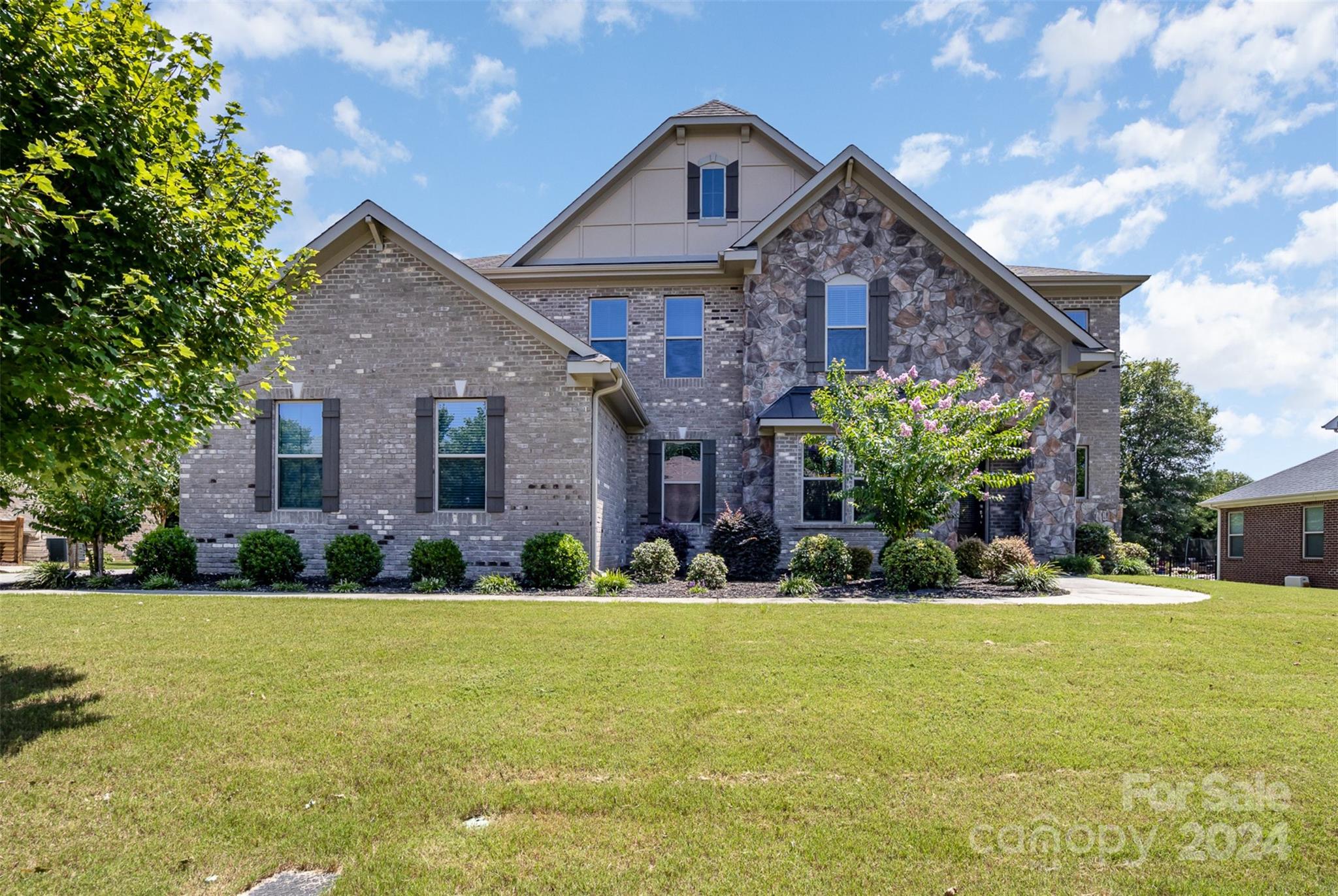 8742 Whitehawk Hill Road Waxhaw, NC 28173 - Photo 1 of 29 a front view of a house with a yard