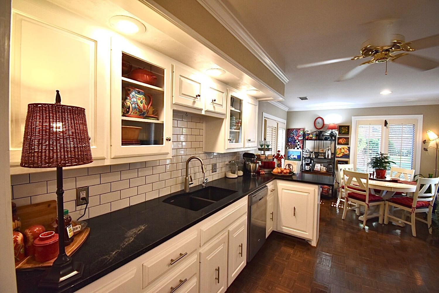 8201 Durham Avenue Lubbock, TX 79424 - Photo 14 of 33 a kitchen with a sink and cabinets