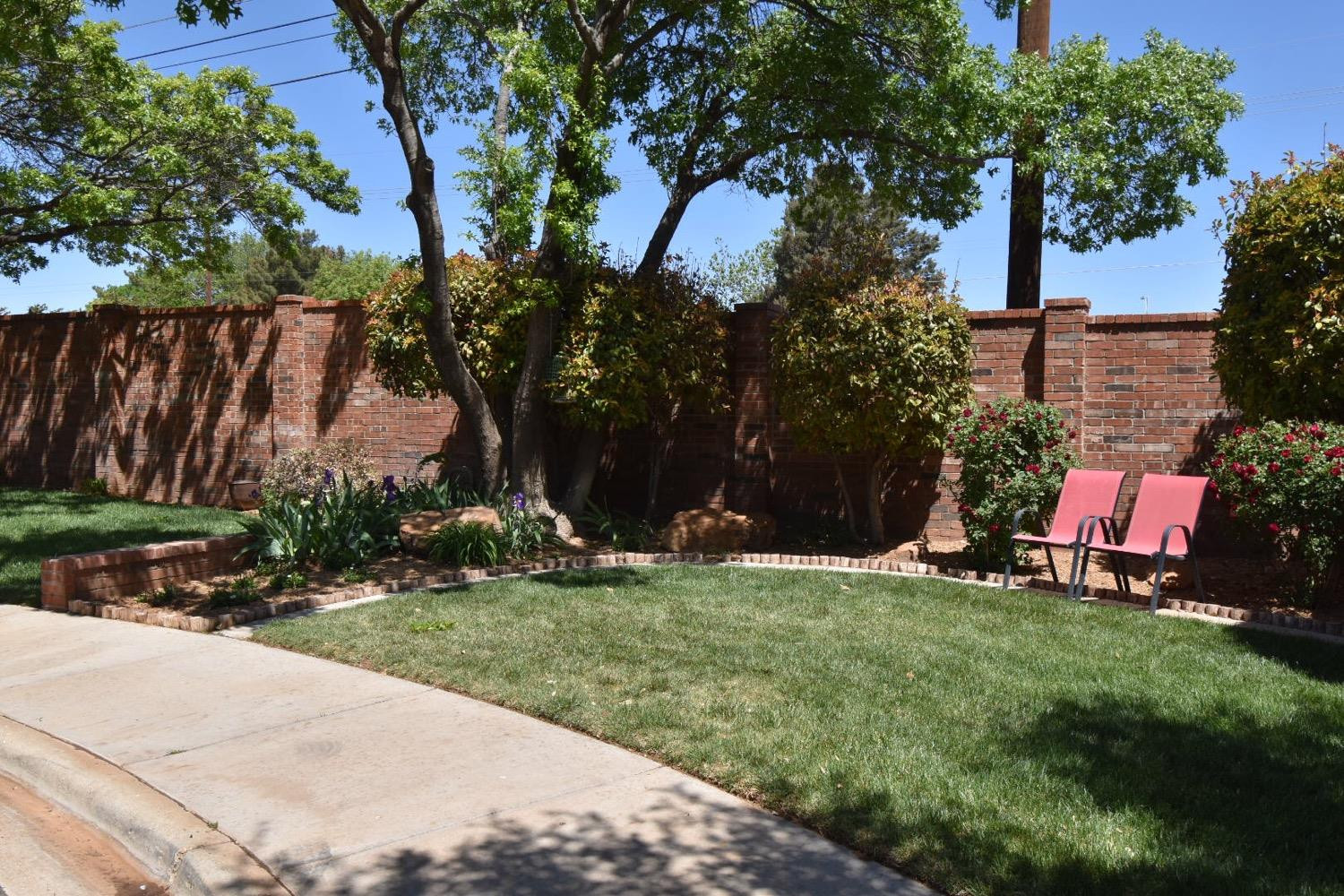 8201 Durham Avenue Lubbock, TX 79424 - Photo 2 of 33 a backyard of a house with lots of green space