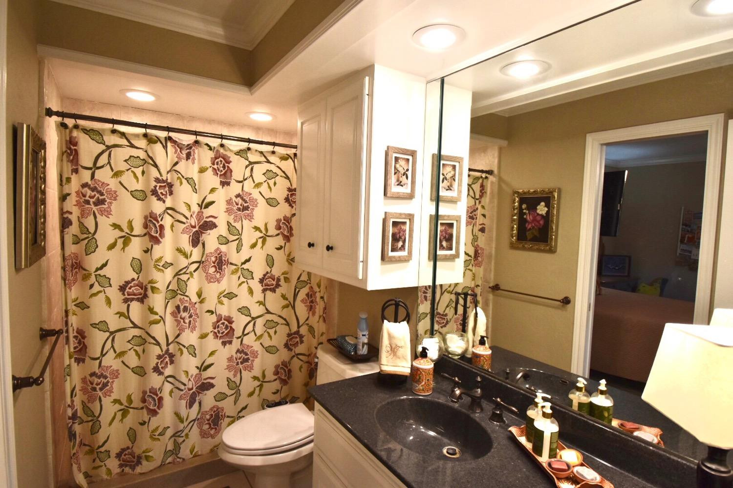 8201 Durham Avenue Lubbock, TX 79424 - Photo 23 of 33 a bathroom with a sink toilet and shower