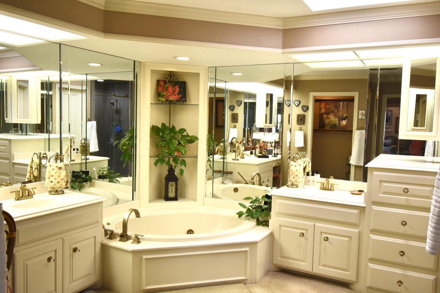 8201 Durham Avenue Lubbock, TX 79424 - Photo 27 of 33 a bathroom with a double vanity sink mirror and bathtub