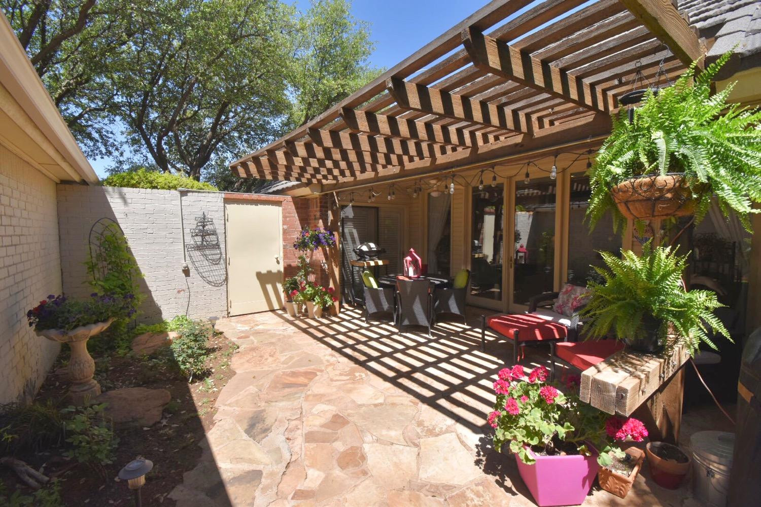 8201 Durham Avenue Lubbock, TX 79424 - Photo 32 of 33 a view of a house with potted plants