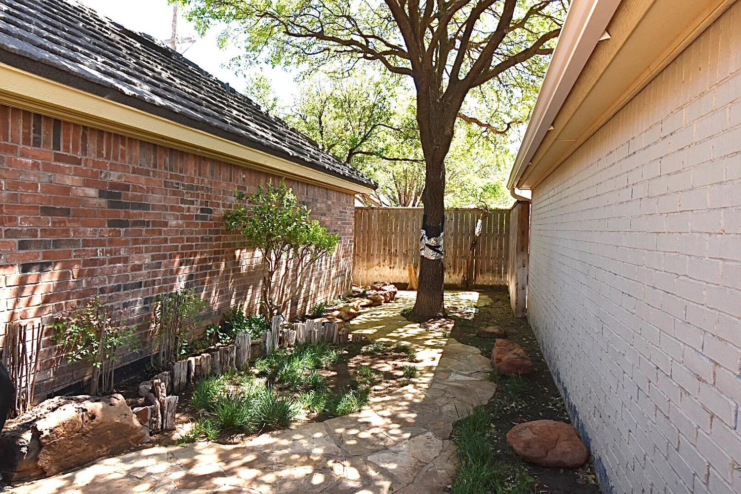 8201 Durham Avenue Lubbock, TX 79424 - Photo 33 of 33 a backyard of a house with lots of green space