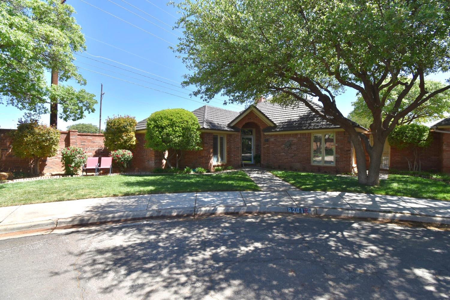 8201 Durham Avenue Lubbock, TX 79424 - Photo 4 of 33 a front view of a house with garden