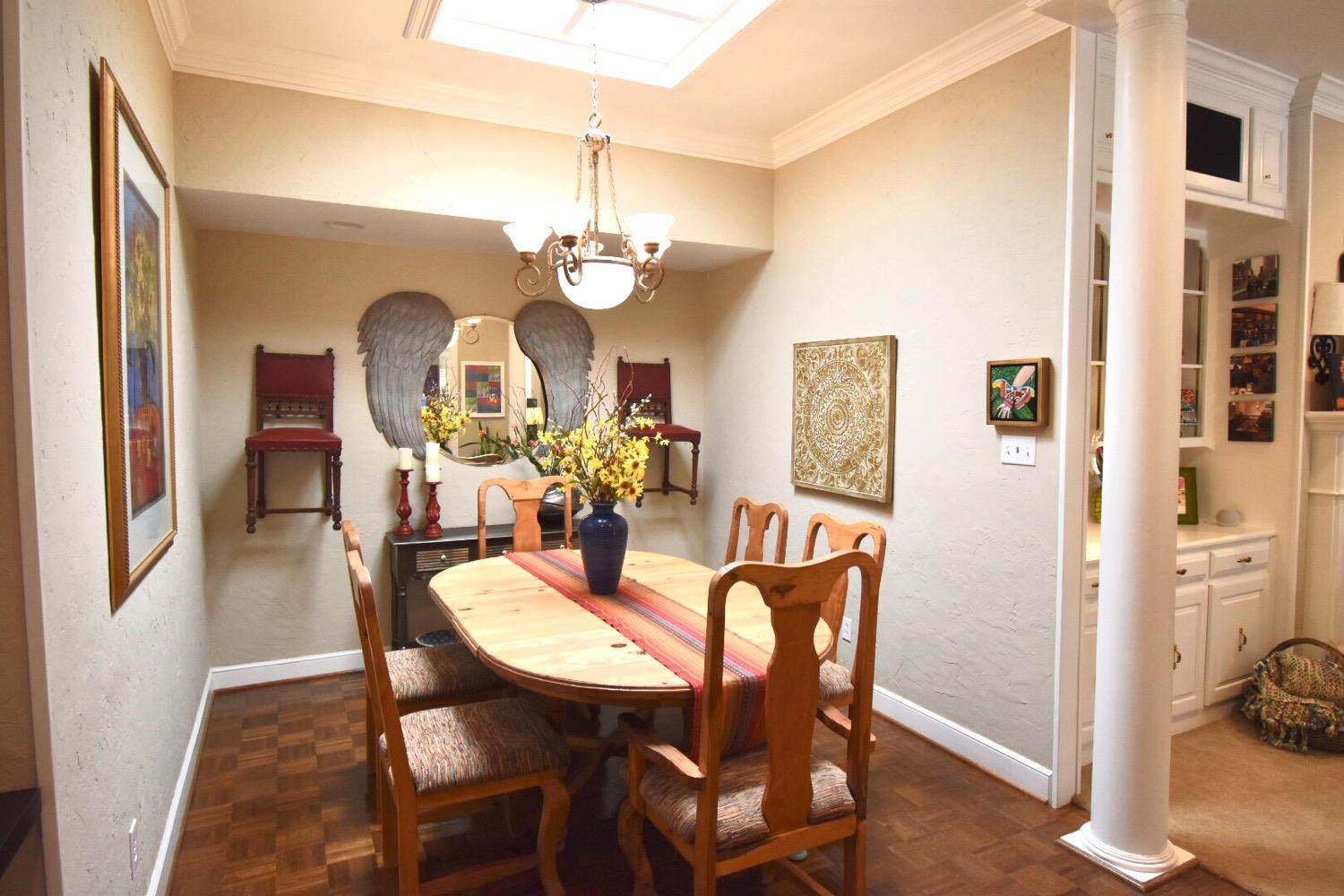 8201 Durham Avenue Lubbock, TX 79424 - Photo 6 of 33 a view of a dining room with furniture and chandelier