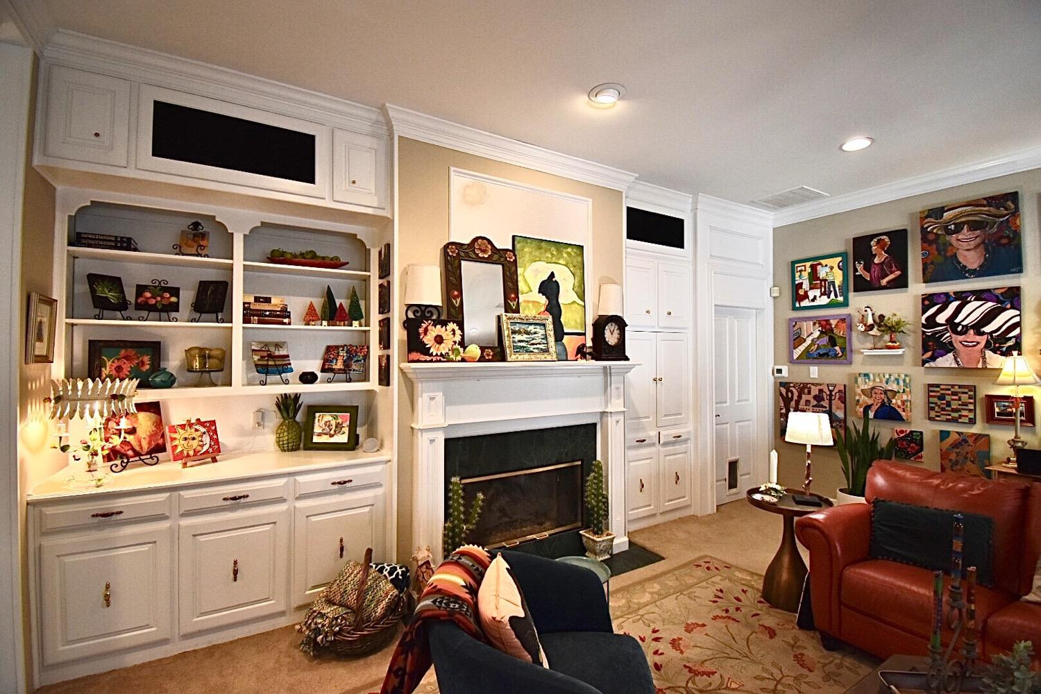 8201 Durham Avenue Lubbock, TX 79424 - Photo 10 of 33 a living room with furniture a flat screen tv and a fireplace