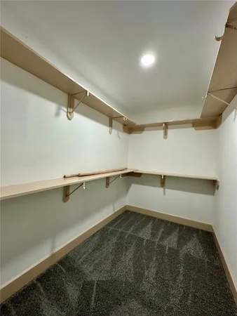a view of a room with racks on the wall