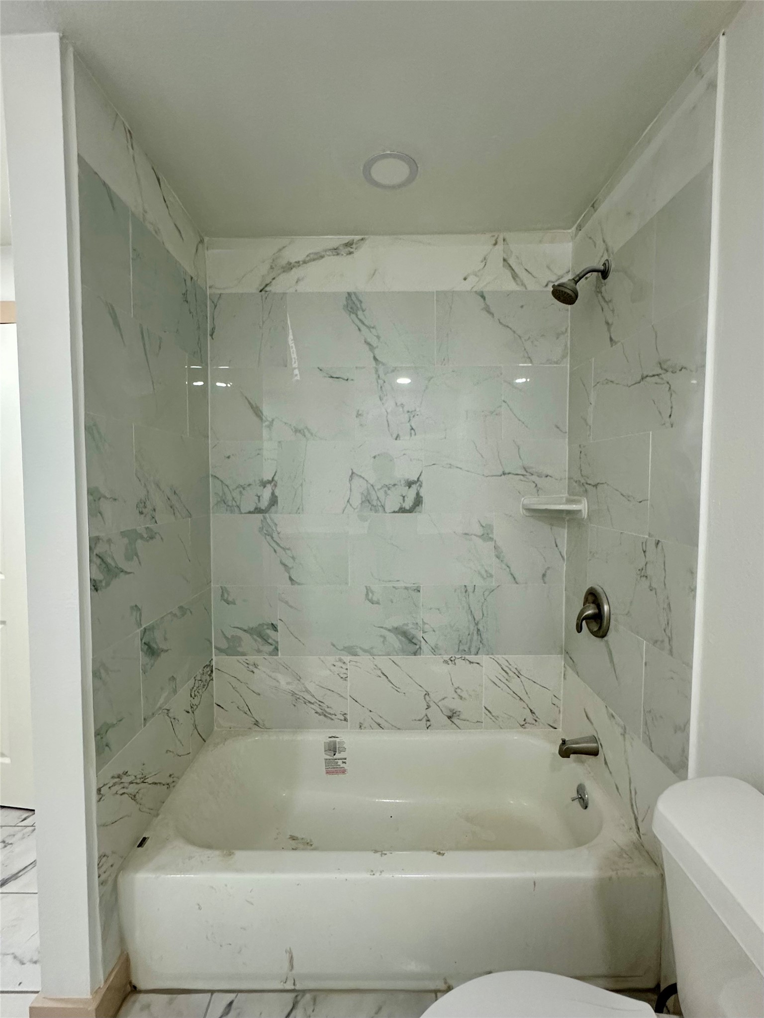 4613 Dewberry Street Houston, TX 77021 - Photo 17 of 17 a bathroom with a bathtub and a shower