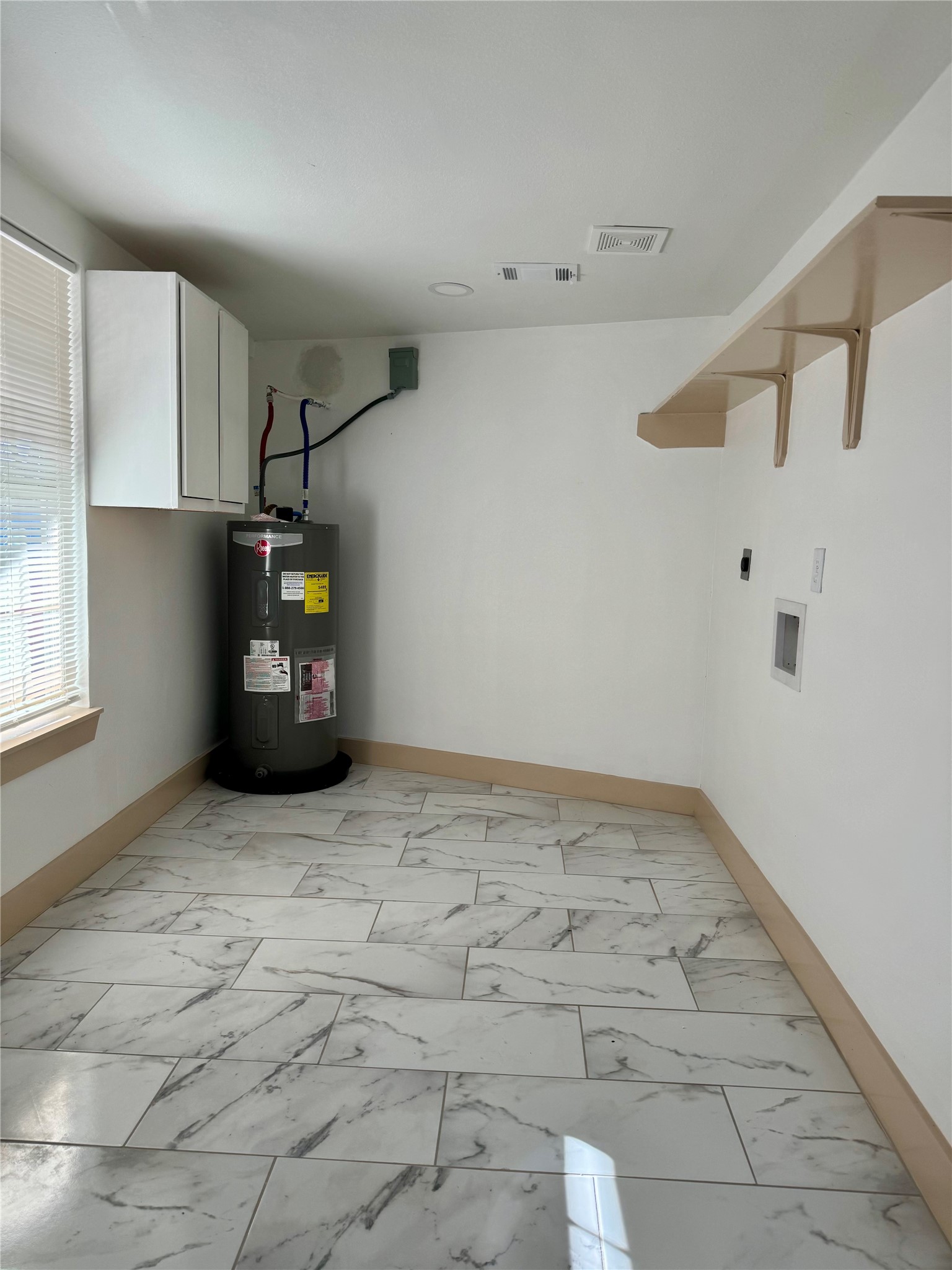 4613 Dewberry Street Houston, TX 77021 - Photo 7 of 17 a view of an empty room with a window