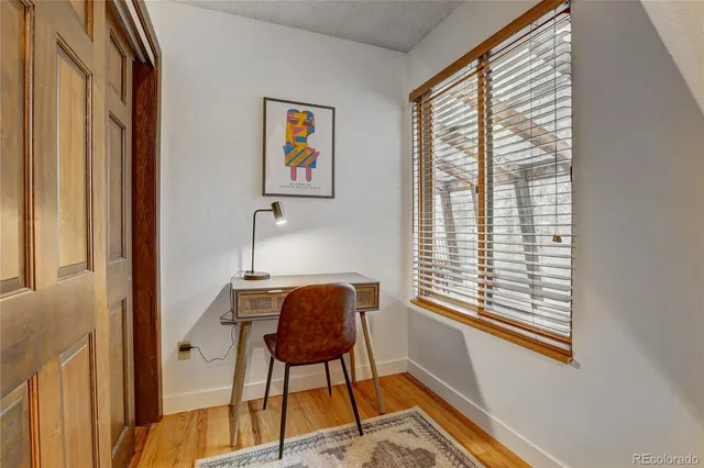 a bedroom with a bed and with windows