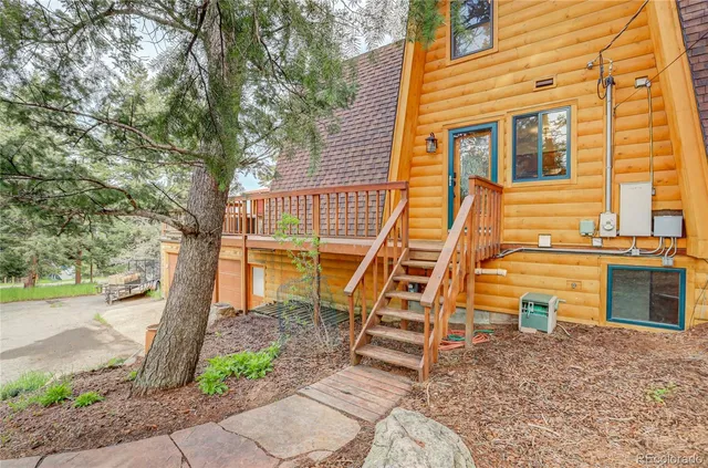 a backyard of a house with barbeque oven