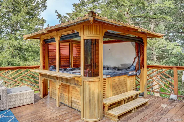 a view of a room with furniture and wooden floor