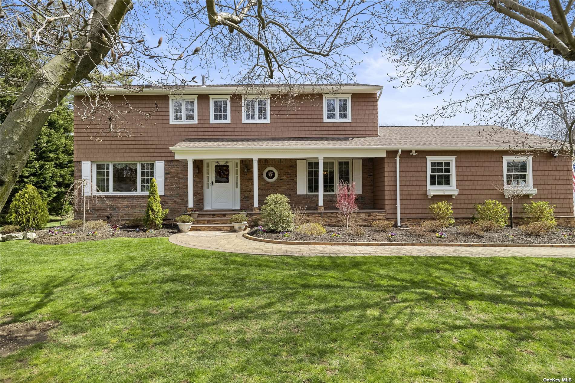 228 Plainview Road Woodbury, NY 11797 - Photo 1 of 1 a front view of a house with yard patio and swimming pool