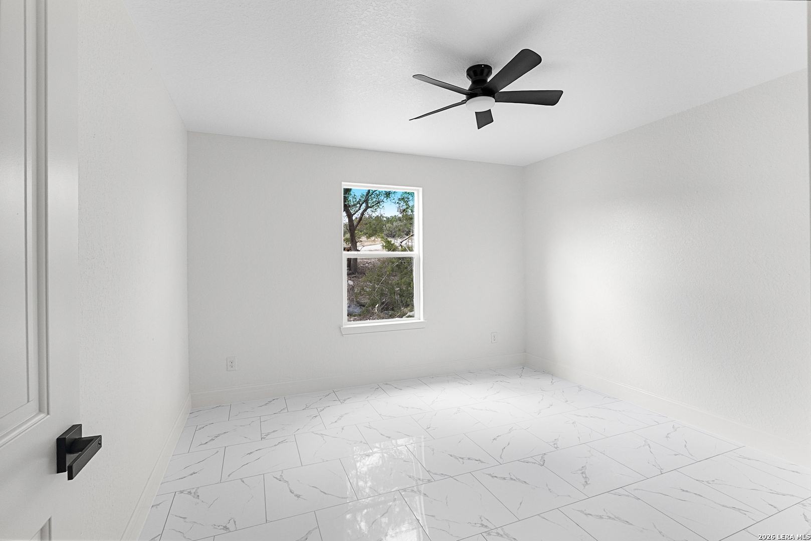 845 Tee Drive Spring Branch, TX 78070 - Photo 11 of 18 an empty room with window and ceiling fan